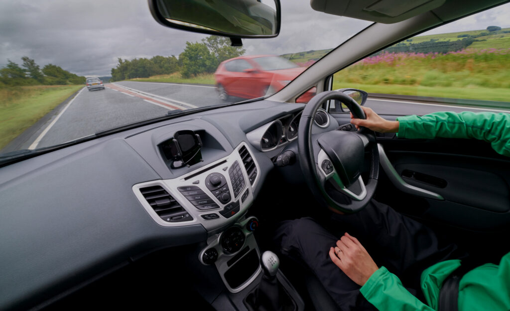 Car interior with driver transferring customer from KL showcasing comfort and clean setup.
