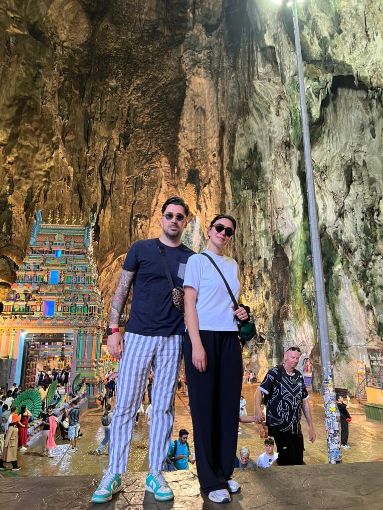 Inside Batu Caves – natural cave ceiling with Hindu altars.