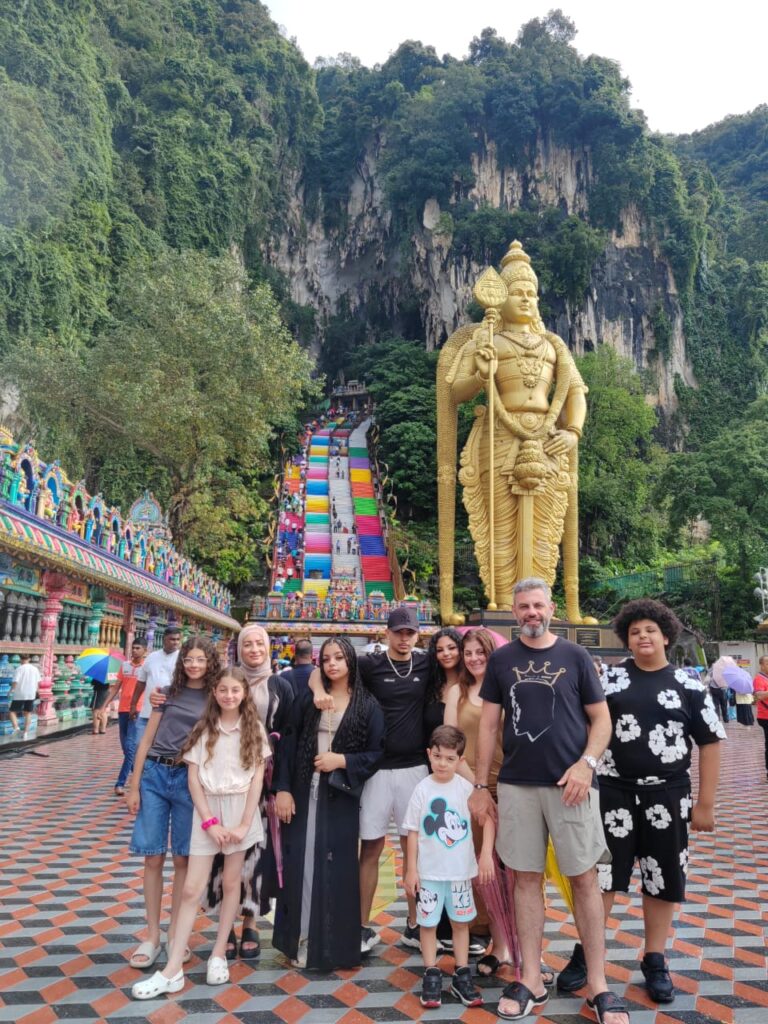 Batu Caves golden statue and steps – a must-visit during KL car hire.